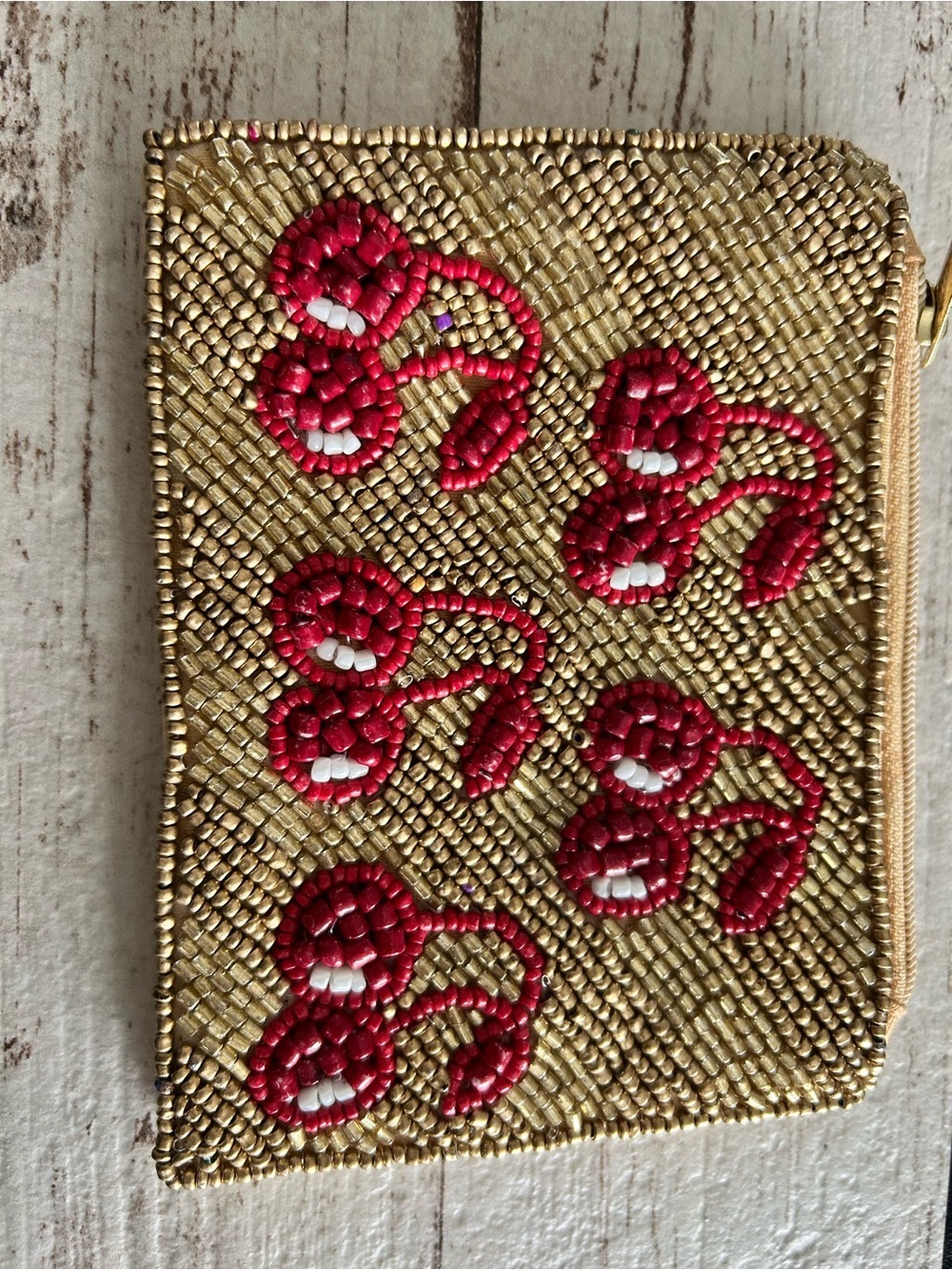 4/$50 Gold Beaded Cherry Wristlet with Red Accents